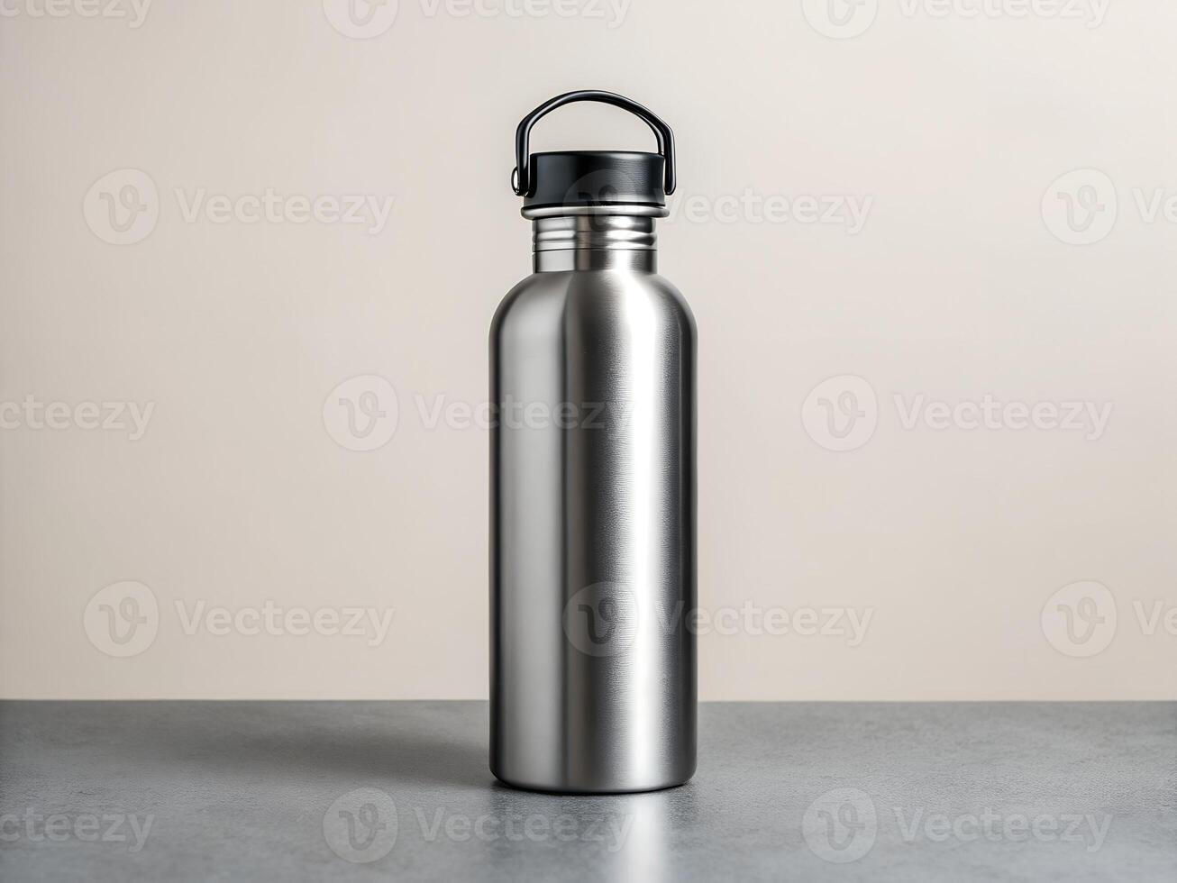 a stainless steel water bottle with a black lid photo