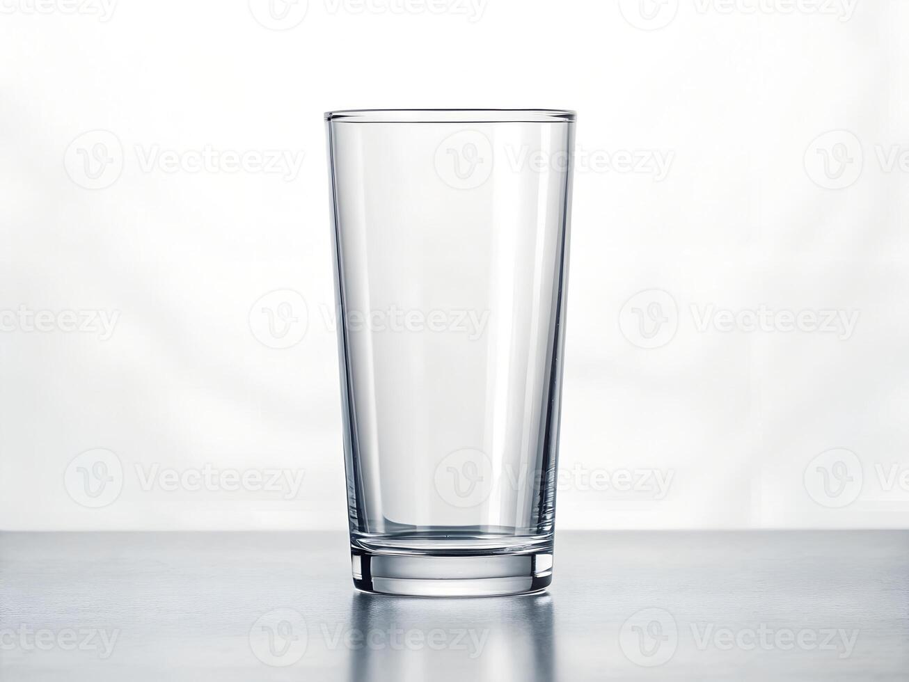 Empty Clear Glass on Grey Surface, Minimalist Studio Shot photo