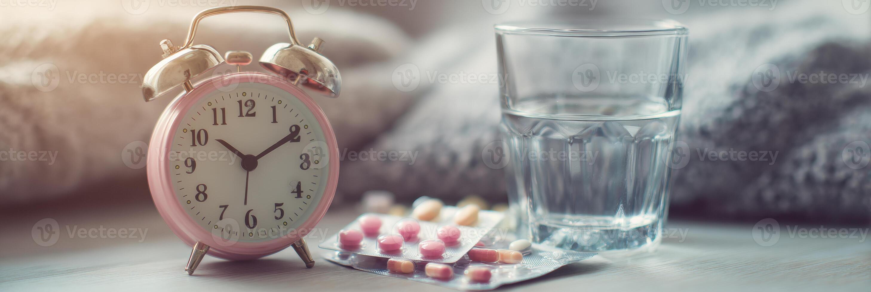 Morning Routine With Bedside Clock, Glass of Water, and Medications on Cozy Blanket During Early Hours photo