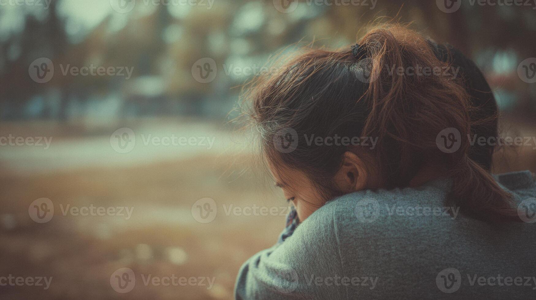 Silent Embrace Captures Deep Emotional Connection Between Two Individuals in a Serene Outdoor Setting During the Afternoon photo