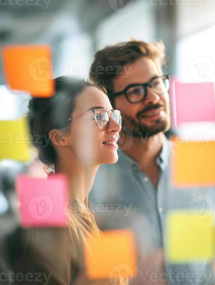 Intercultural Team Collaborates With Sticky Notes During Brainstorming Session in Bright Office Environment photo