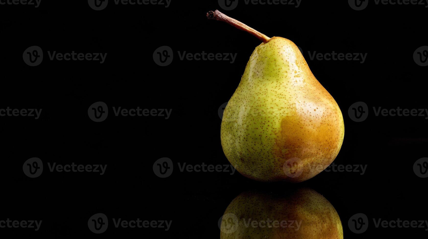 Single Pear Resting on Reflective Black Glass With Dramatic Lighting for Captivating Visual Impact photo