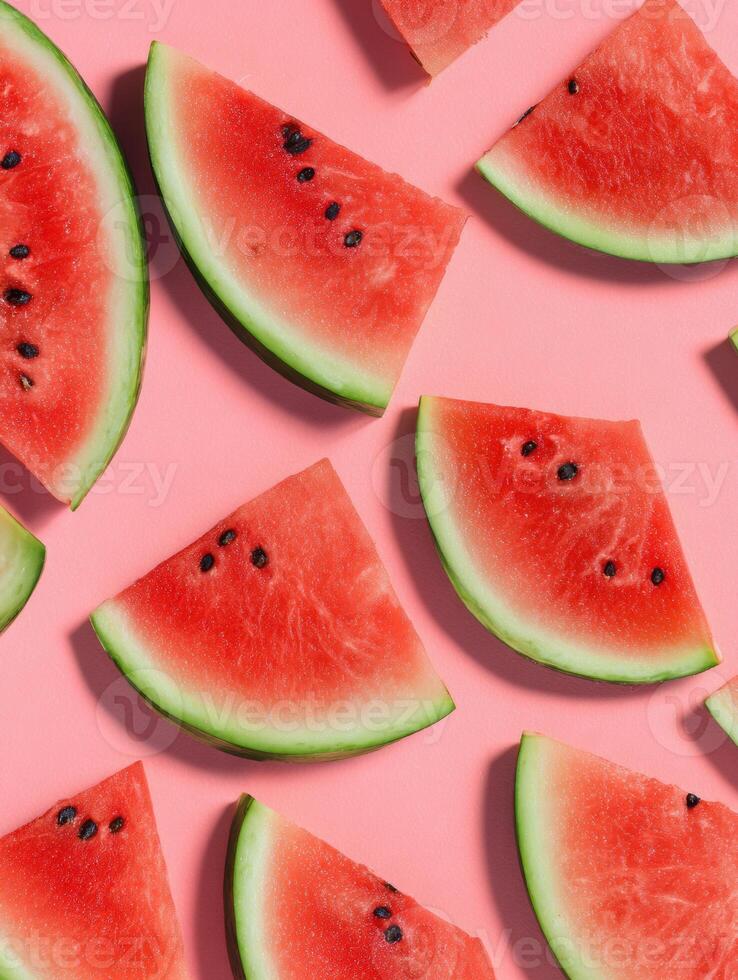 Watermelon Slices Arranged in a Geometric Pattern on a Pastel Pink Background With a Clear Space on the Right Side for Additional Design Elements photo
