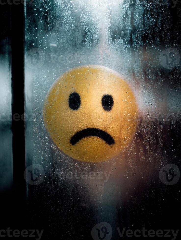 Melancholic Sick Face Drawn on Steamed Glass Window With Moody Tones Revealing a Somber Atmosphere and Empty Space photo