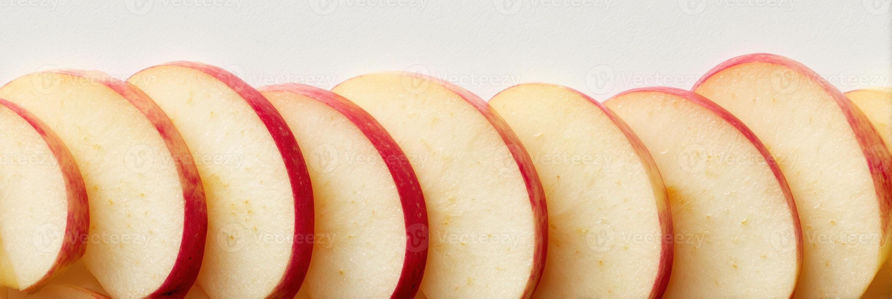 Sliced Apples Arranged Vertically With a Clean Background and Blank Upper Zone for Creative Design and Presentation photo