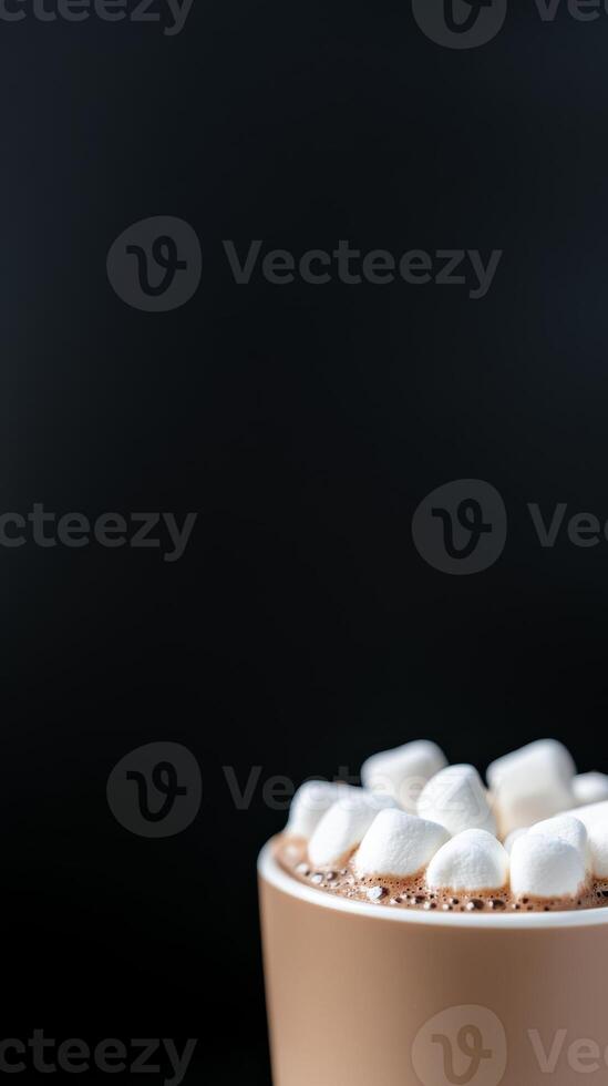 Rich Hot Chocolate with Fluffy White Marshmallows in a Warm Mug on a Dark Background A Cozy Winter Beverage for Comfort and Sweet Indulgence photo
