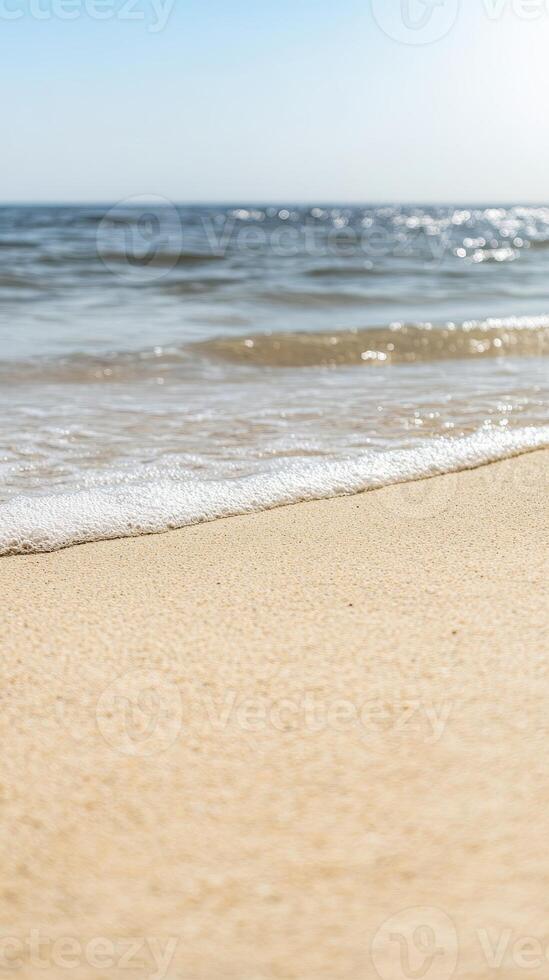 Golden Sands Meet Gentle Ocean Waves on a Pristine Beach Shoreline, Bathed in Serene Sunlight photo