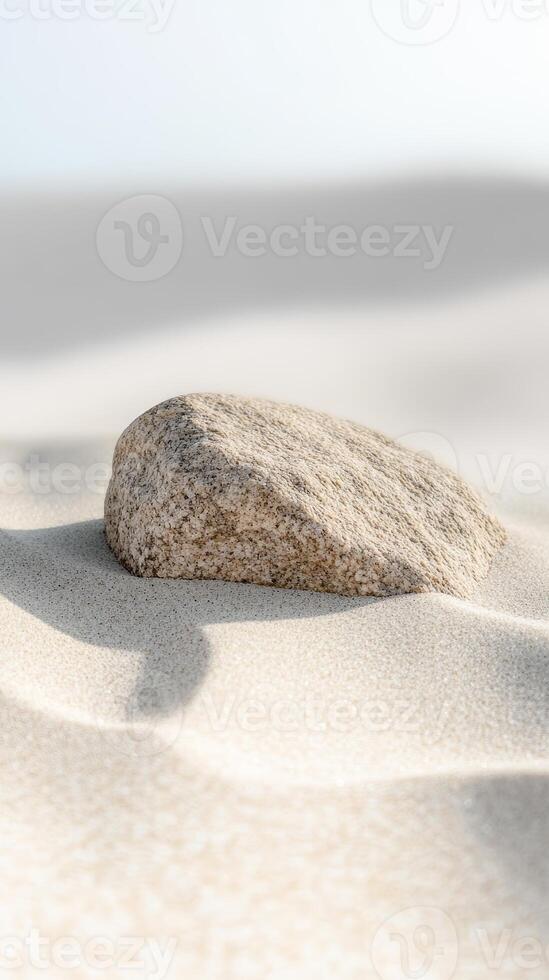Close-up of a weathered stone on soft, golden sand, bathed in natural light, evoking tranquility and the raw beauty of coastal landscapes. photo