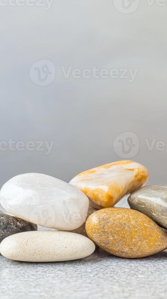Serene Collection of Polished River Stones A Tranquil Array of Natural Pebbles in Earth Tones for Zen Decor and Peaceful Backgrounds photo