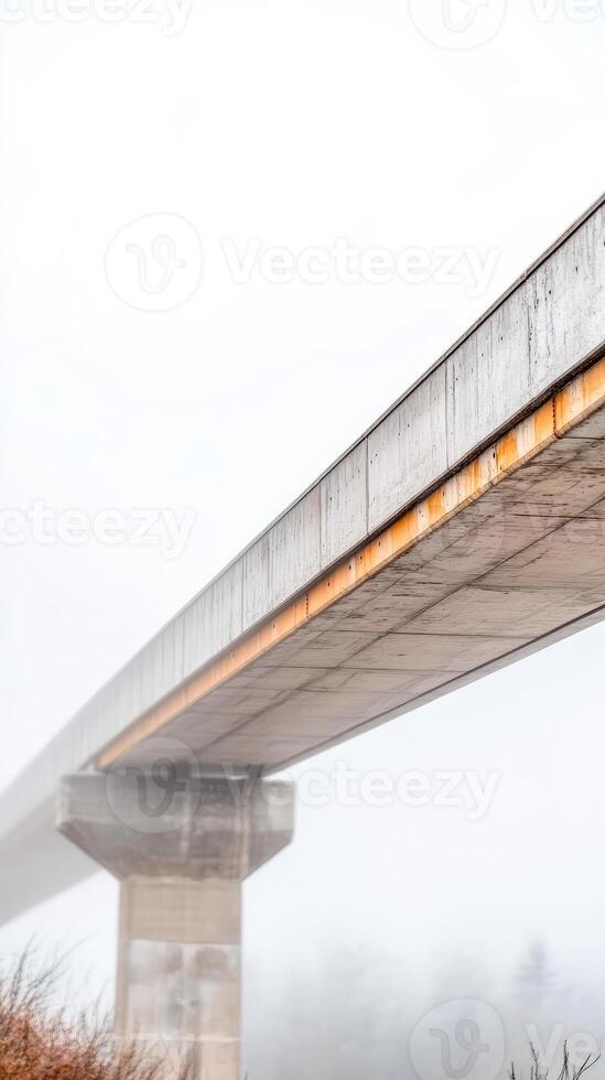 Concrete Bridge Structure Disappearing in Dense Fog A Moody Architectural Landscape. Elevated Pathway with Industrial Aesthetic photo