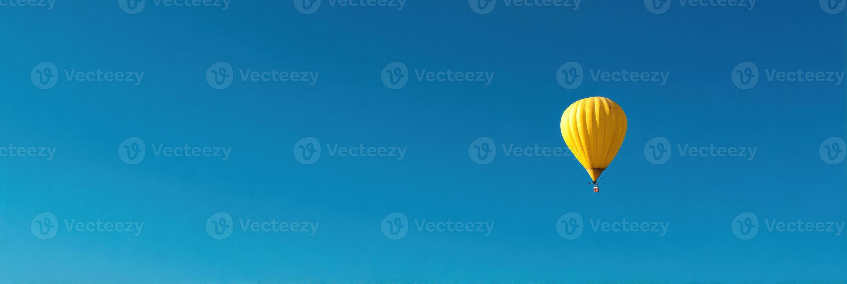 Surreal Hot Air Balloon Made of Banana Floating in a Clear Blue Sky With Ample Empty Space at the Top photo