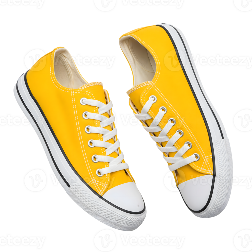 A pair of yellow canvas sneakers with white laces are isolated on transparent background png