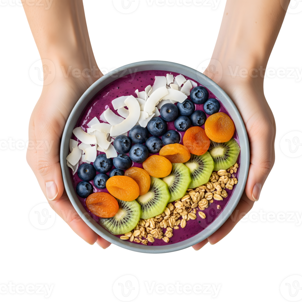 A vibrant acai smoothie bowl, brimming with fresh blueberries, kiwi, apricots, coconut flakes, and granola, held delicately in two hands isolated on transparent background png