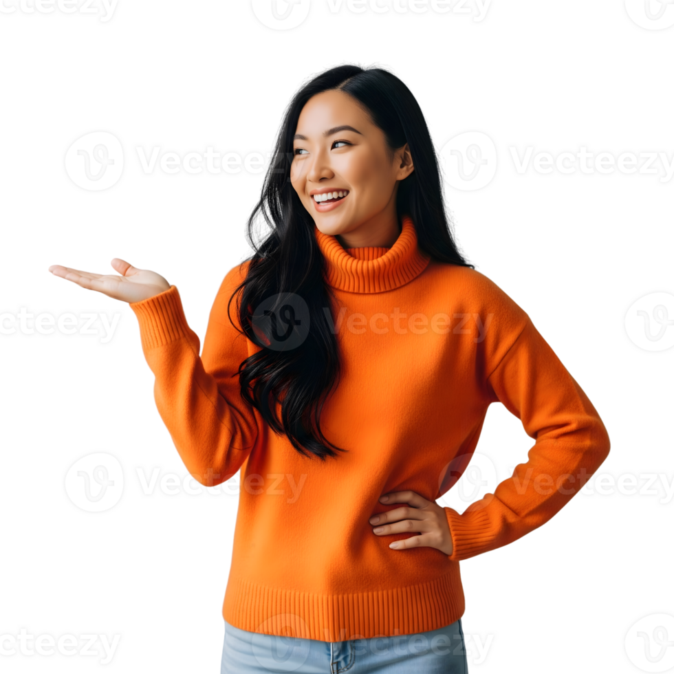 Smiling asian woman in orange sweater presenting something isolated on transparent background png
