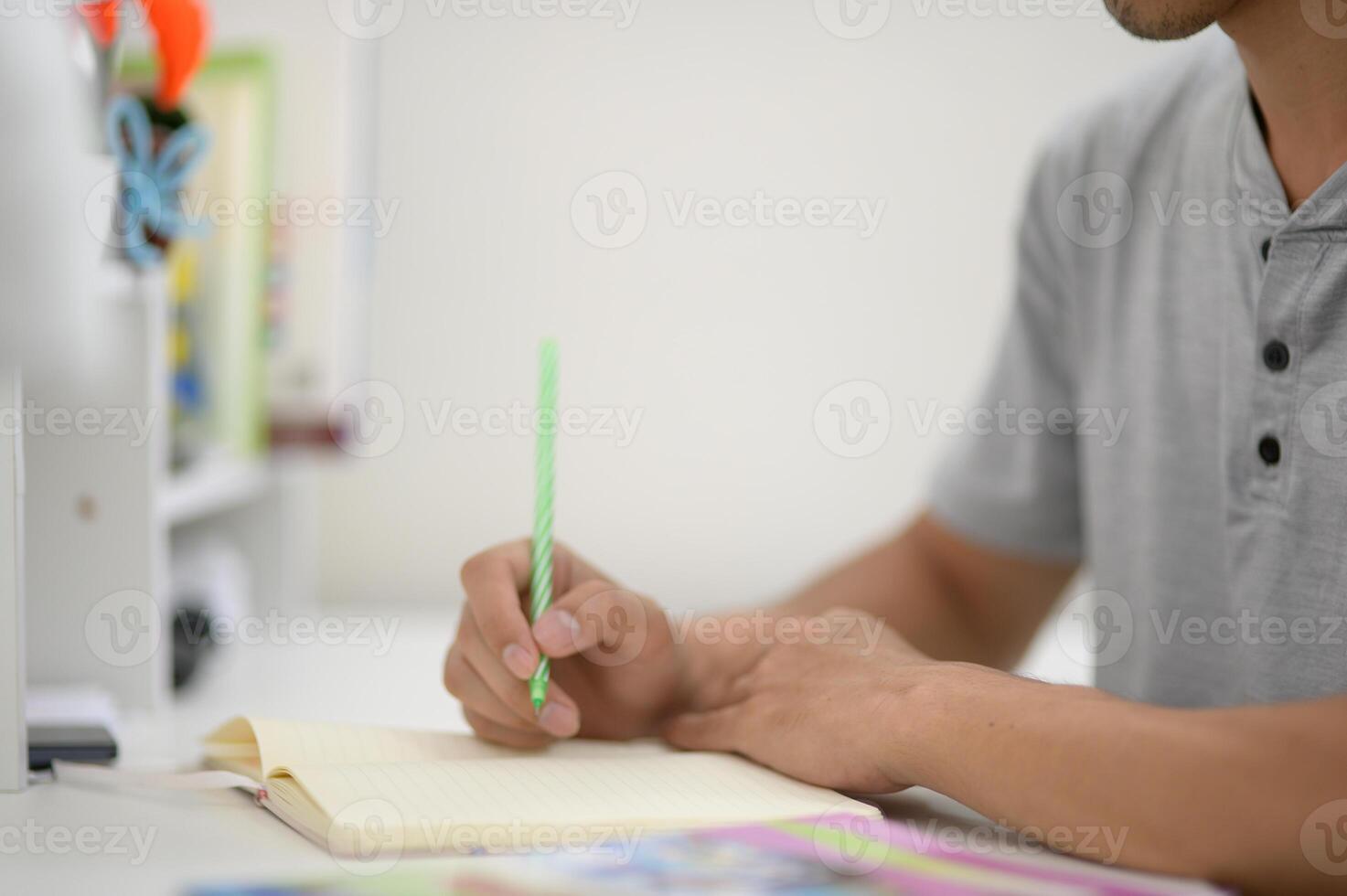 Conference Writing Session with Notepad and Green Pen in Office photo