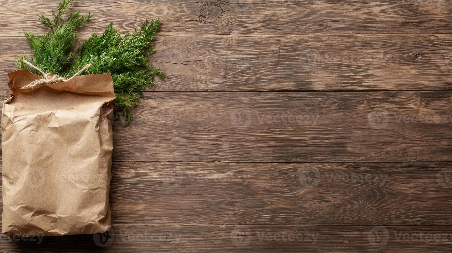 paper bag with fresh green herbs on wooden background photo