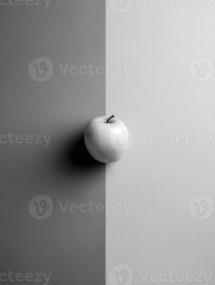 Grayscale Layout Featuring a Single Colored Apple Highlighting Minimalist Design in a Symmetrical Composition With a Contrasting Backdrop photo