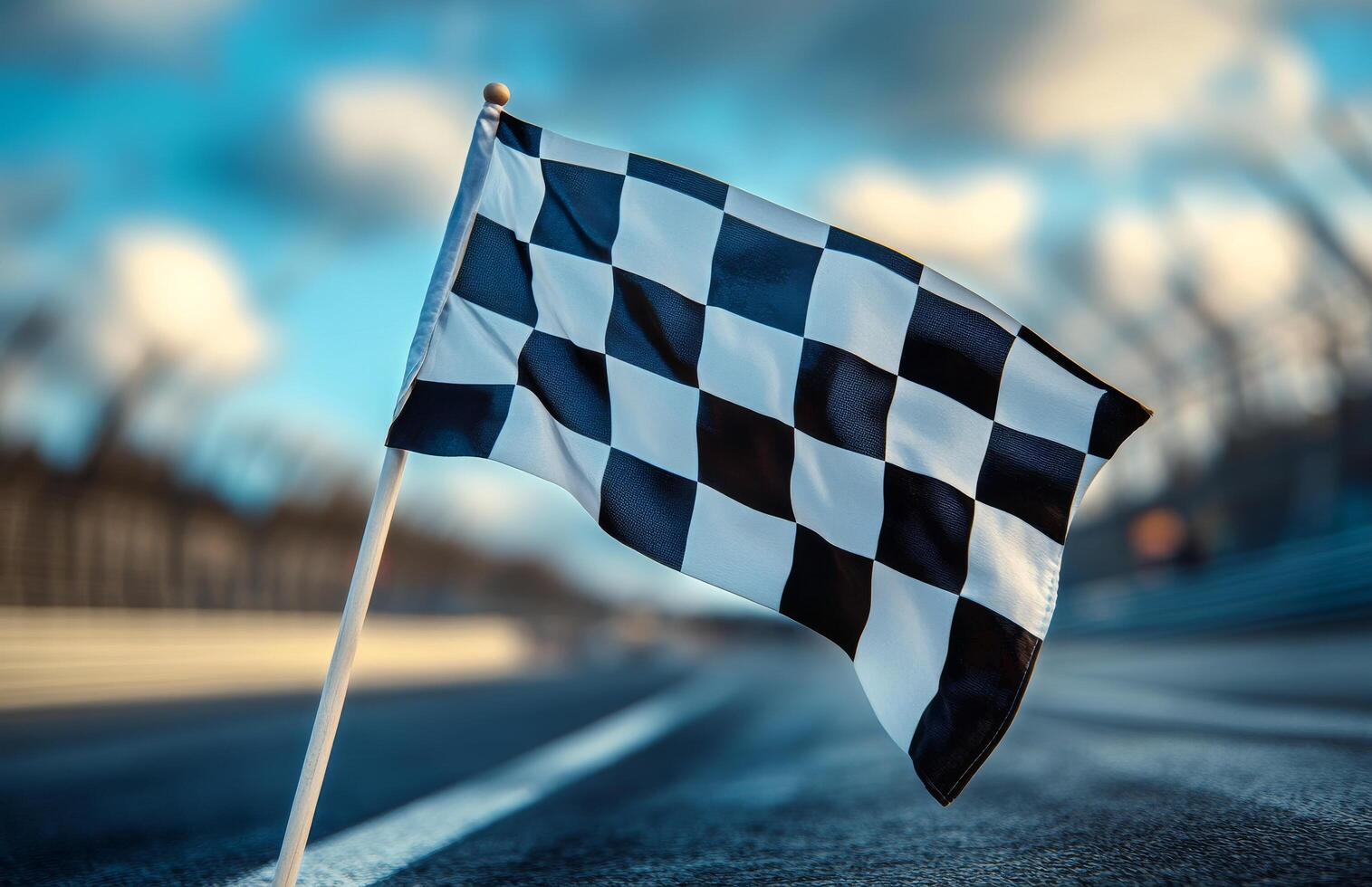 Checkered Flag Positioned at Racetrack Signaling End of Race During Afternoon Light photo