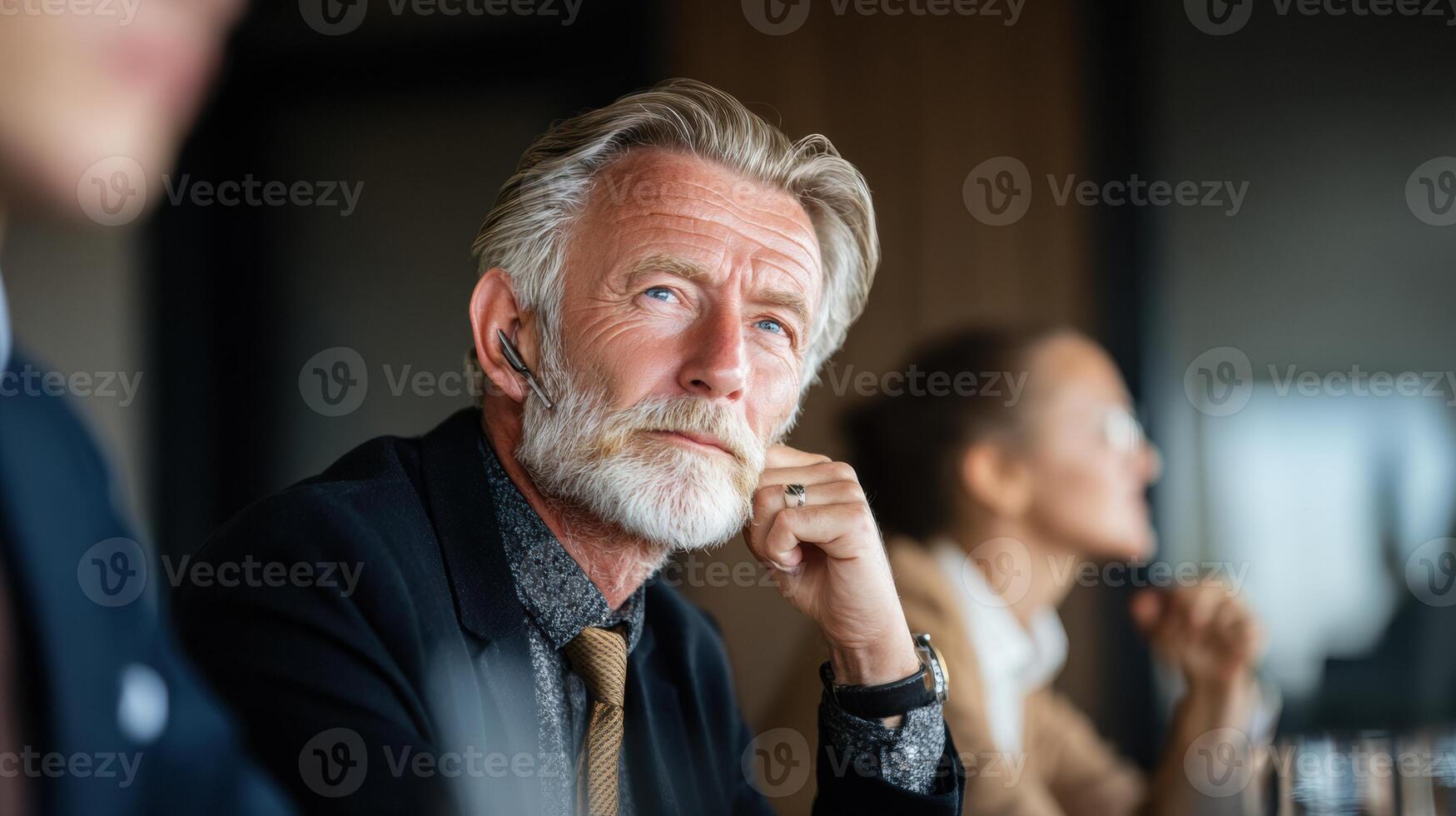 Thoughtful Senior Businessman Engaged in a Meeting, Reflecting on Strategic Decisions in a Modern Office Environment During Mid-Morning Hours photo
