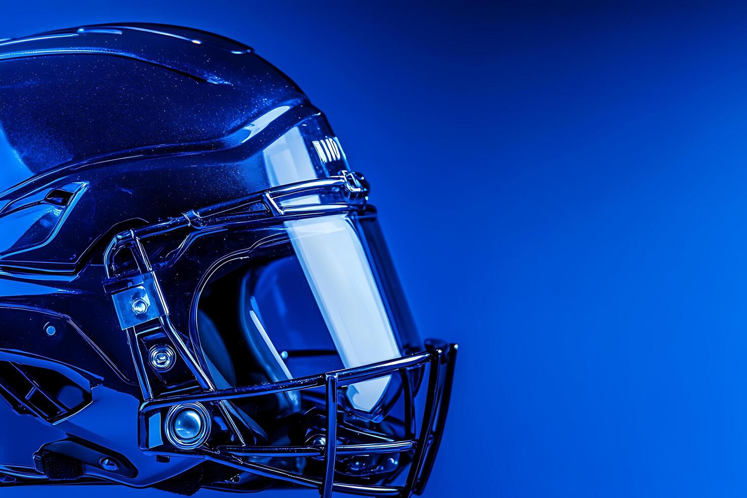 Close-up of a Shiny Blue American Football Helmet Against a Blue Background. photo