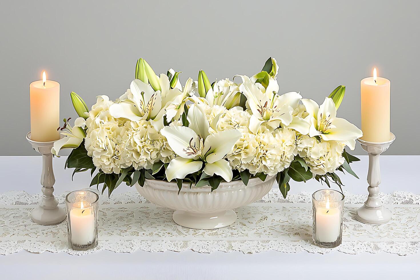 Elegant White Lily and Hydrangea Centerpiece with Candles. A serene and sophisticated floral arrangement perfect for weddings, memorials, or special events. photo