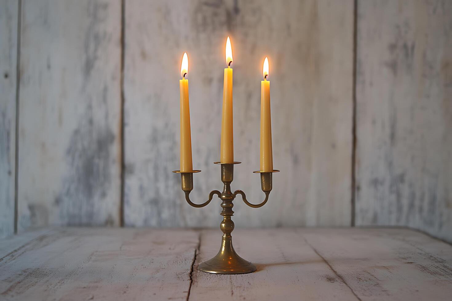 Three Lit Candles on Antique Brass Candelabra. A rustic, elegant image perfect for home decor, relaxation, and spirituality. photo