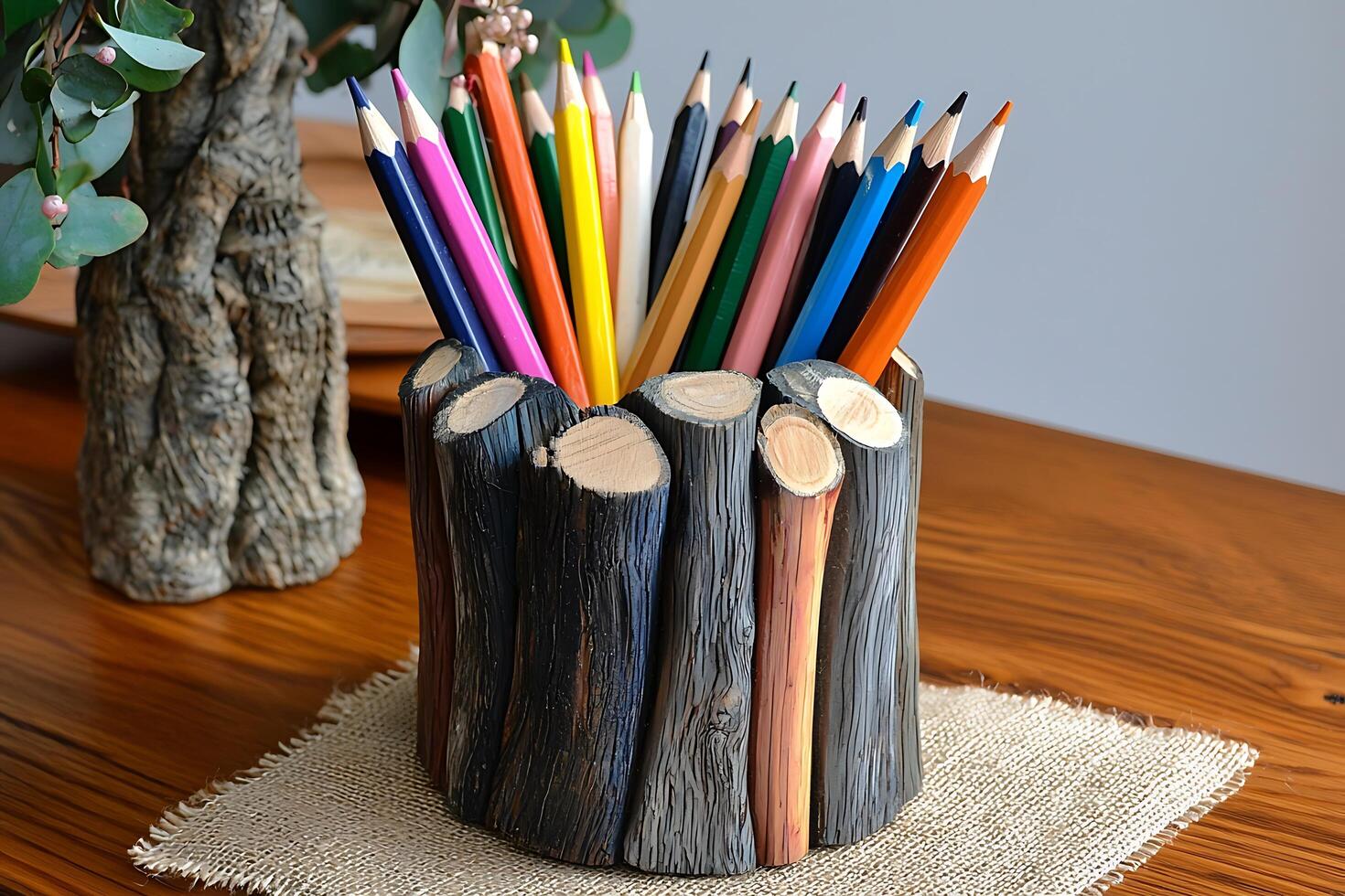 Colorful Pencils in a Rustic Wooden Holder. A charming still life image showcasing creativity and handcrafted artistry. photo