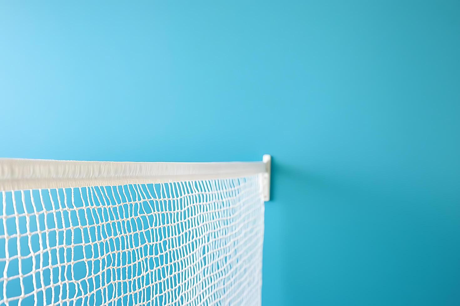 White Netting Against a Teal Background Perfect for Sports, Safety, or Decorative Designs. photo