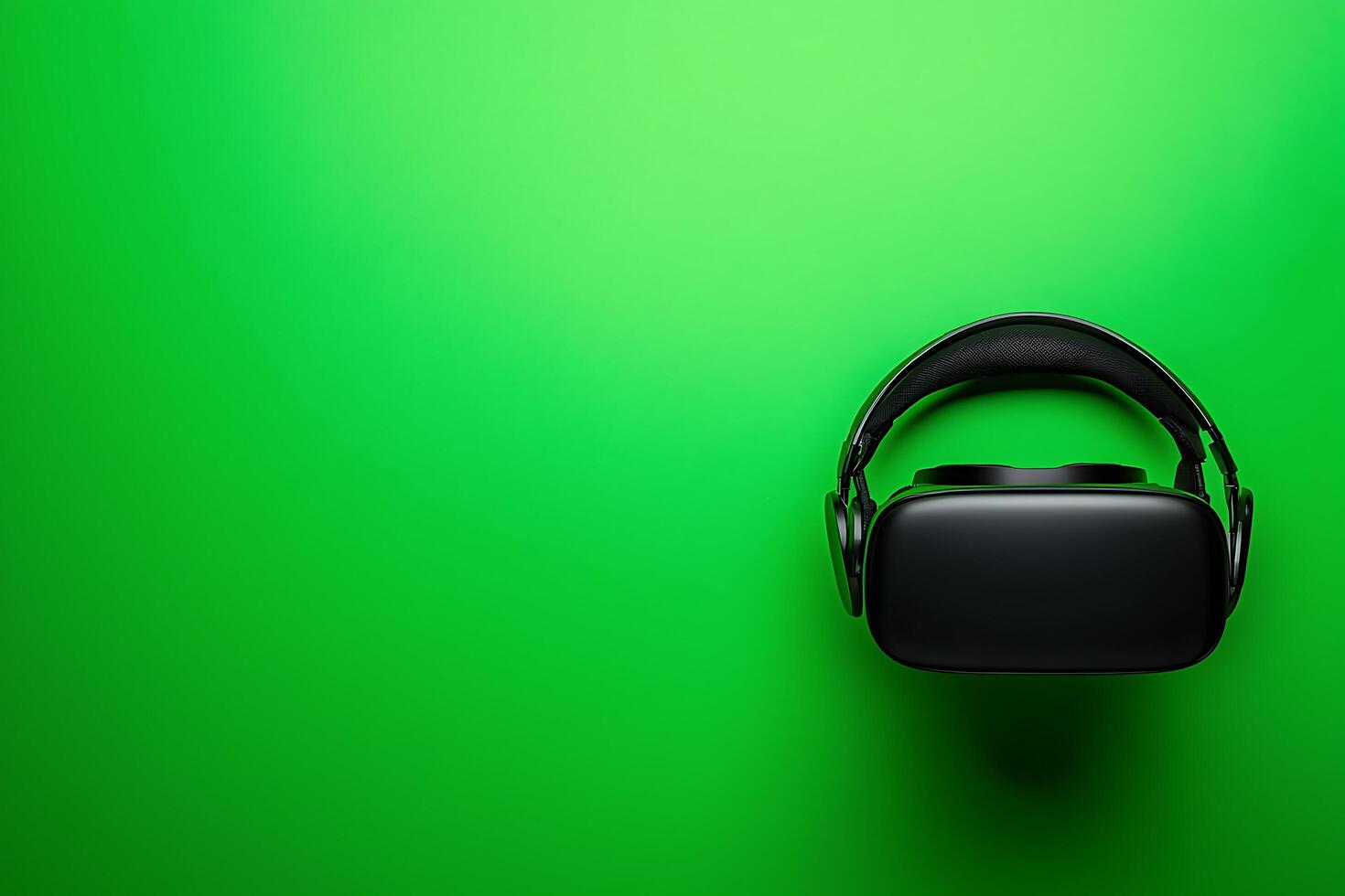 Black VR Headset on Green Background Technology and Virtual Reality Concept. photo