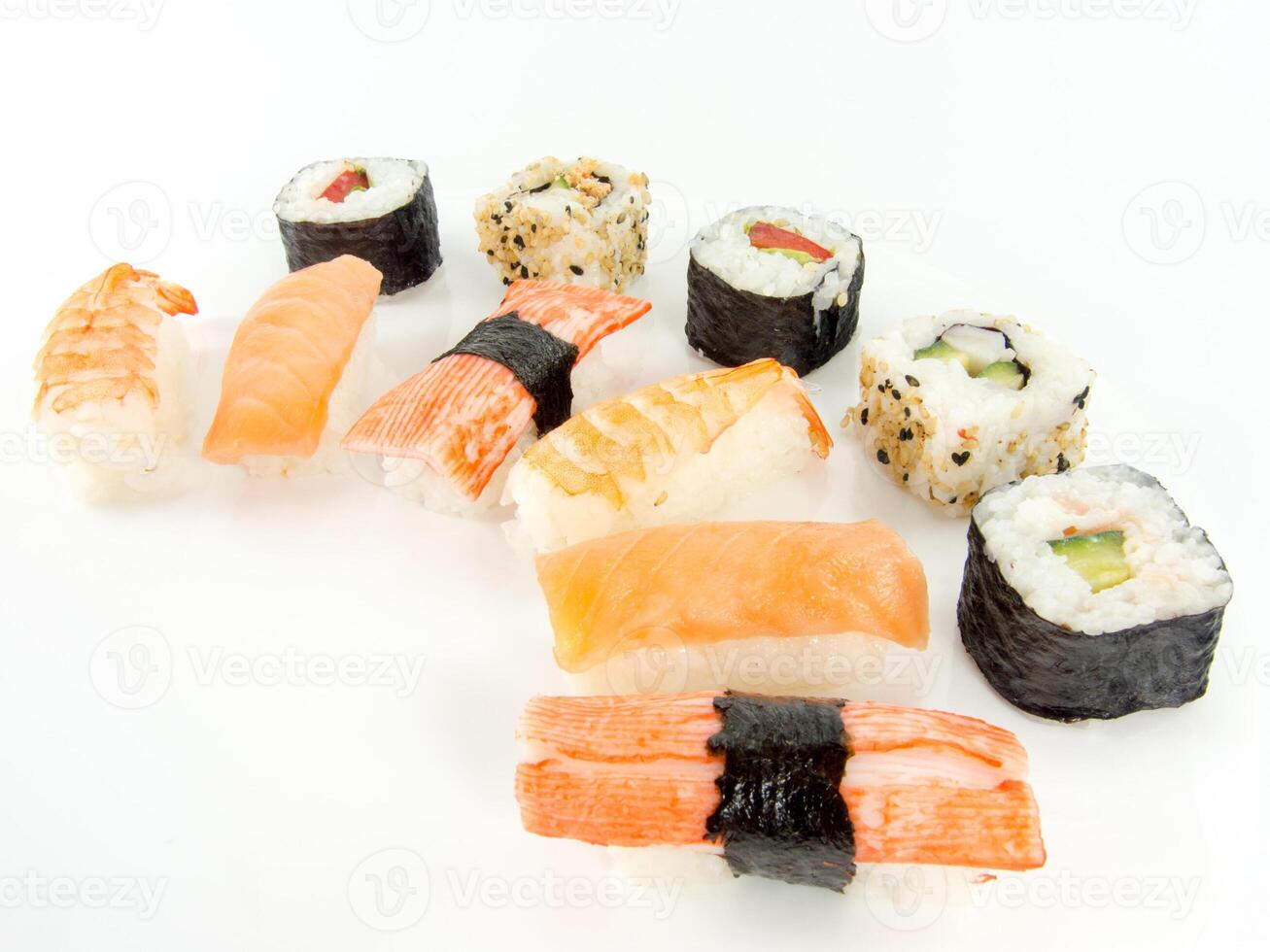 assorted delicious japanese traditional sushi over white photo