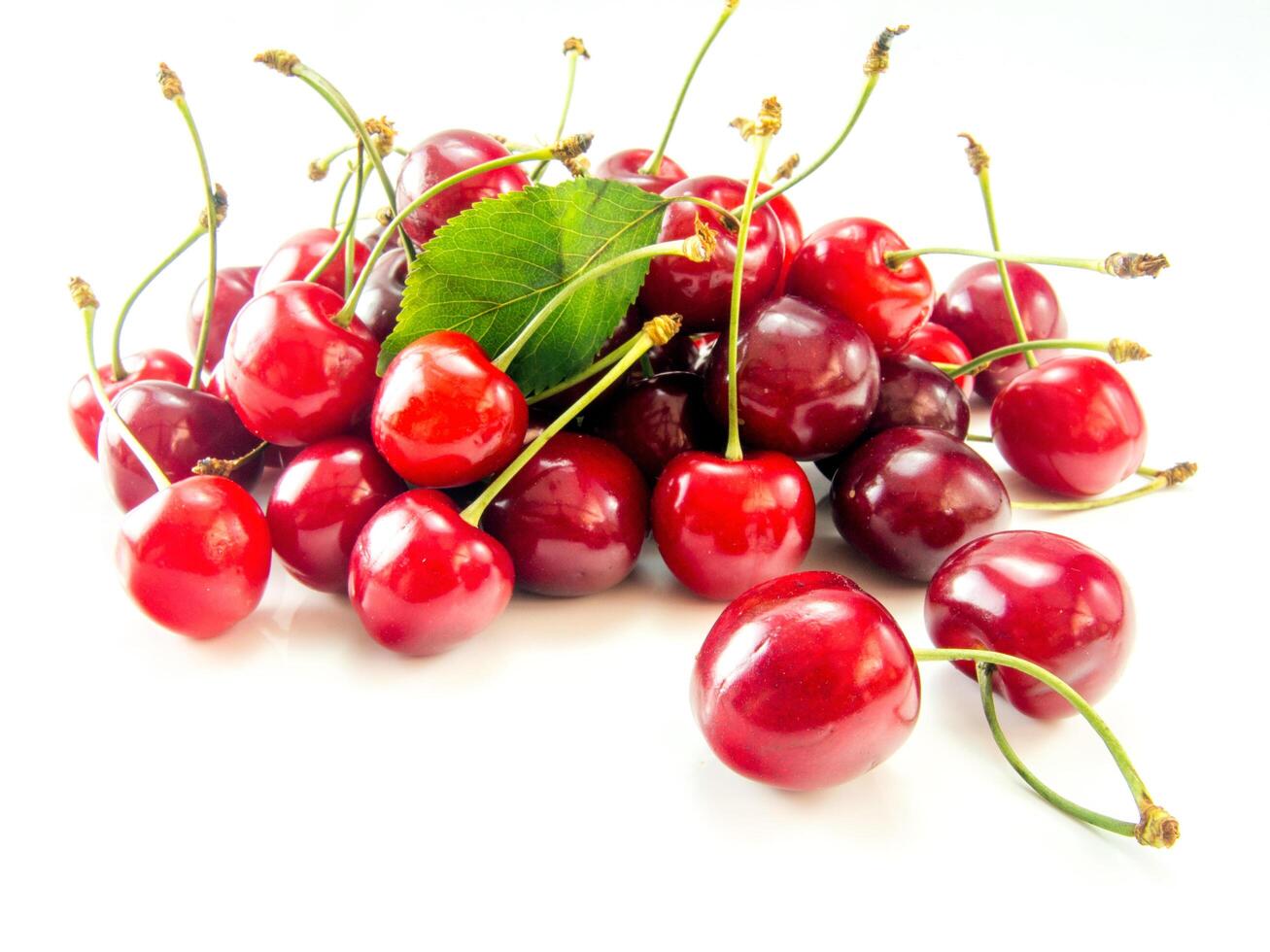 A bunch of cherries on a white background photo