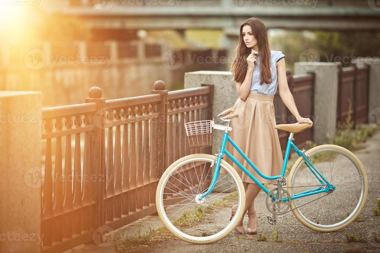 Smiling Hipster Girl and Bike in the City and Copy Space. Urban Youth Lifestyle Concept. bike ride photo
