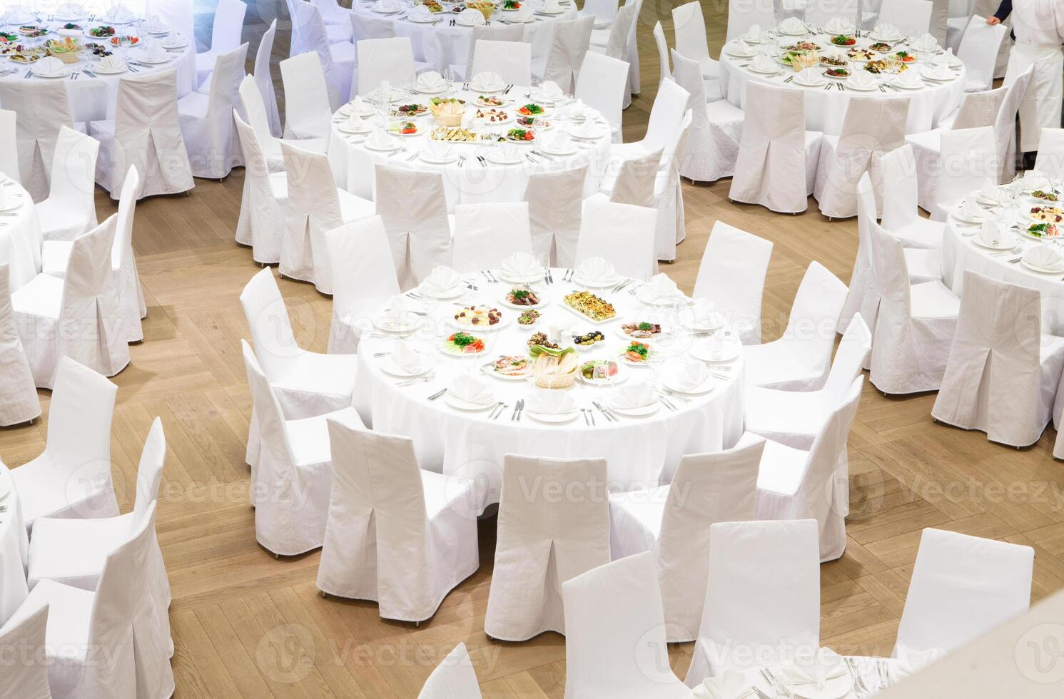 Beautifully organized event - served banquet tables ready for guests photo