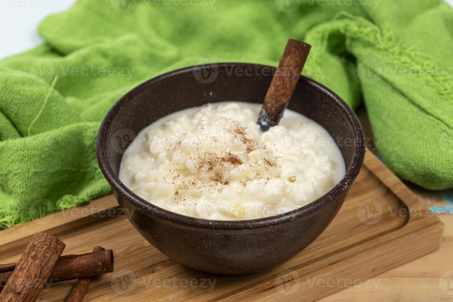 Typical Brazilian sweet dessert, made with Canjica corn. White porridge with cinnamon and coconut and condensed milk. Consumed in June festivities festa Junina 2 photo