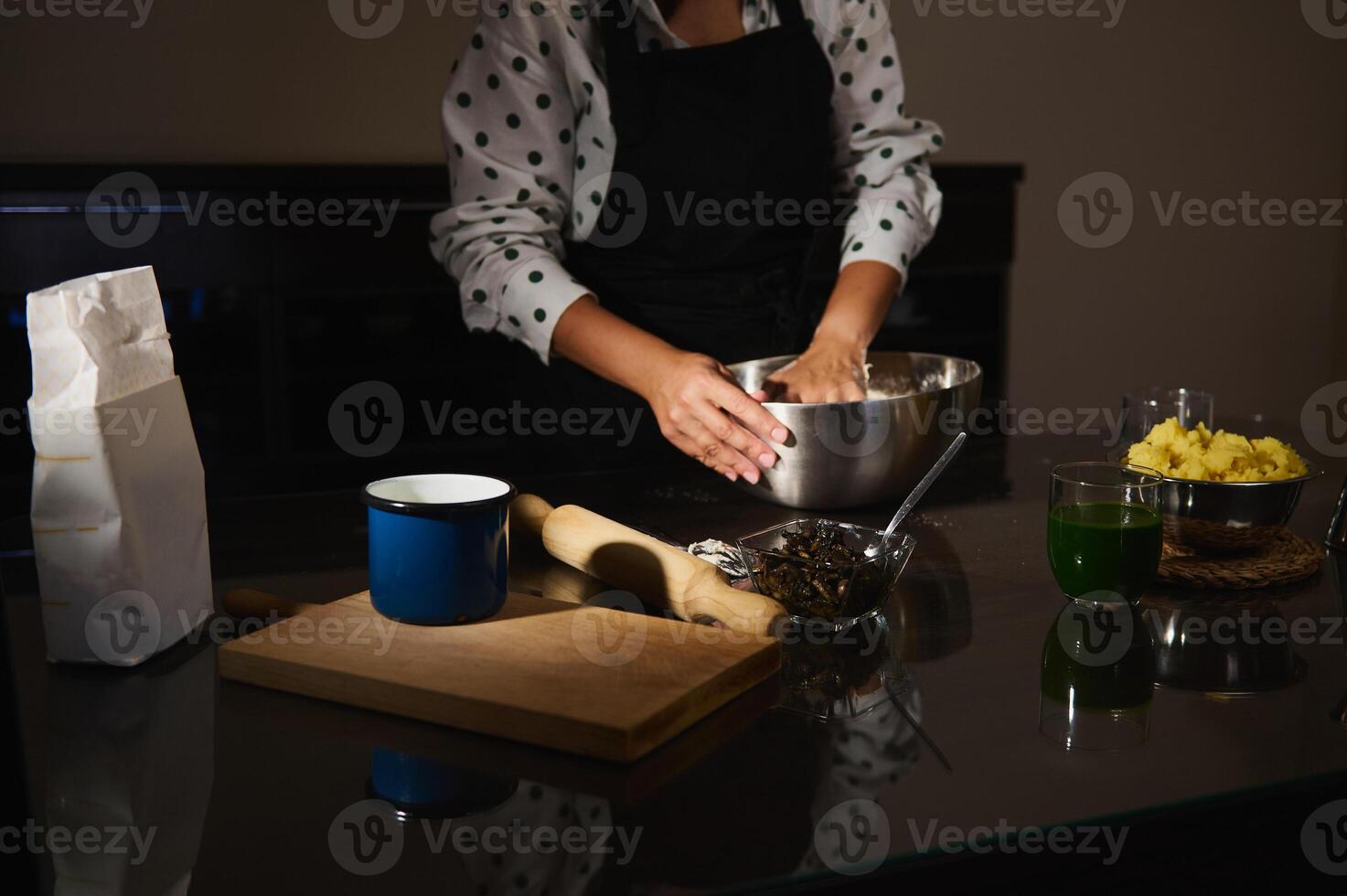 Home Chef Preparing Dough for Dumplings in a Cozy Kitchen Setting photo