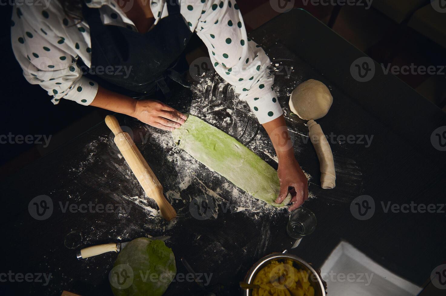 Overhead View of a Chef Preparing Dough for Homemade Pasta with Rolling Pin photo