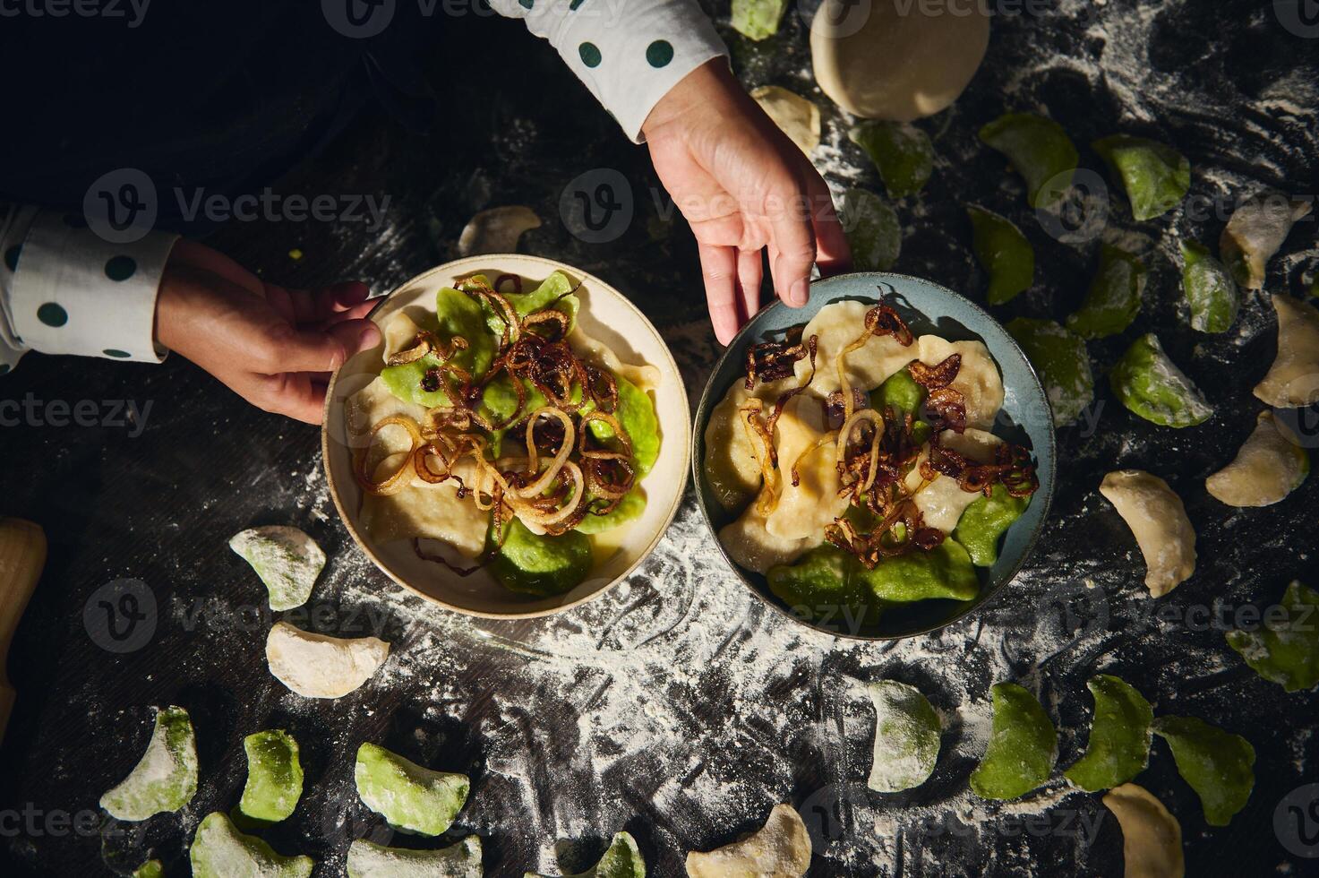 Preparation and Presentation of Handmade Dumplings with Onion Garnish in Rustic Setting photo