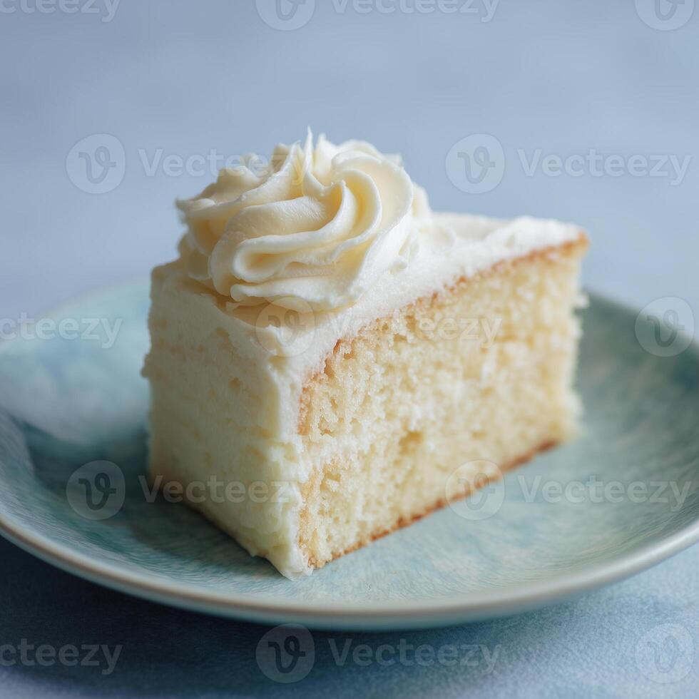 Slice of White Cake with Frosting on a Plate photo