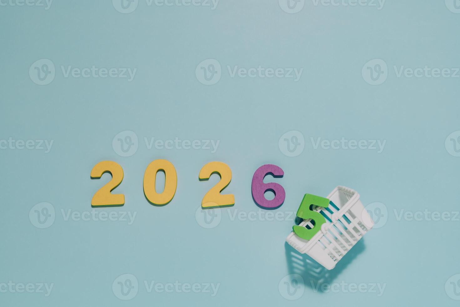 Numerals 2026 stand boldly as 5 rests in a white basket. Perfect for themes of transition, progress, and anticipating the year 2026. photo