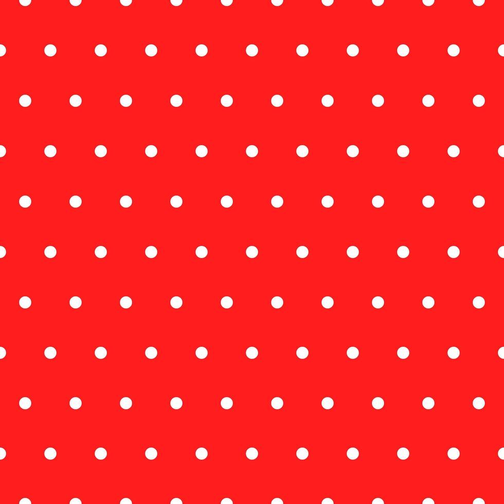 Seamless retro pattern of small white circles on a red background vector