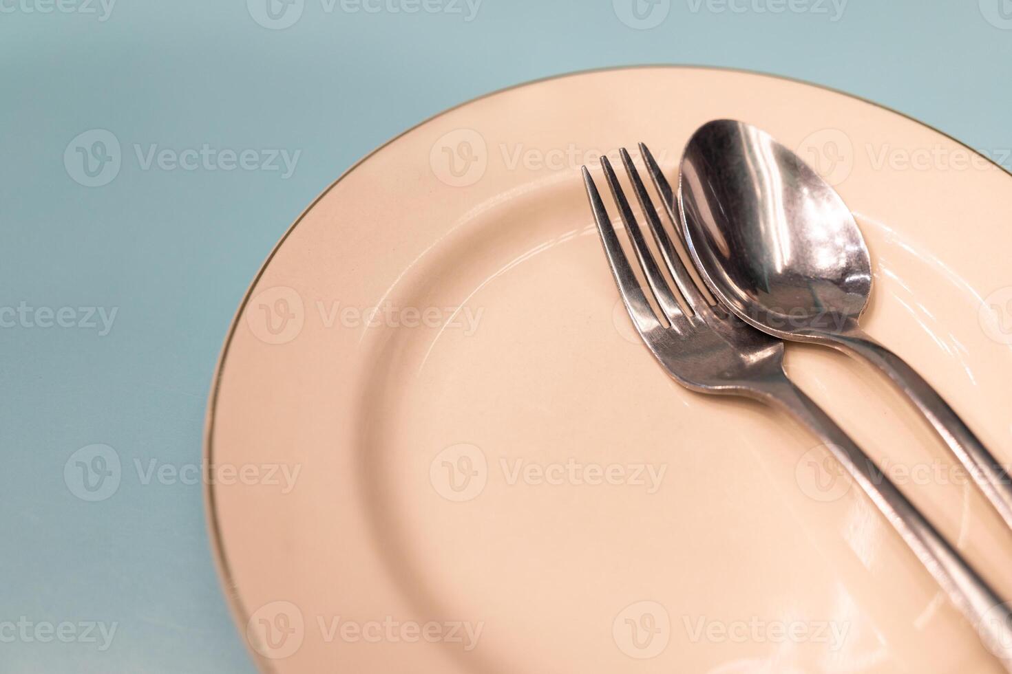 Elegant Place Setting with Spoon and Fork. a sense of dining, simplicity, and anticipation of a meal. Copy space. photo