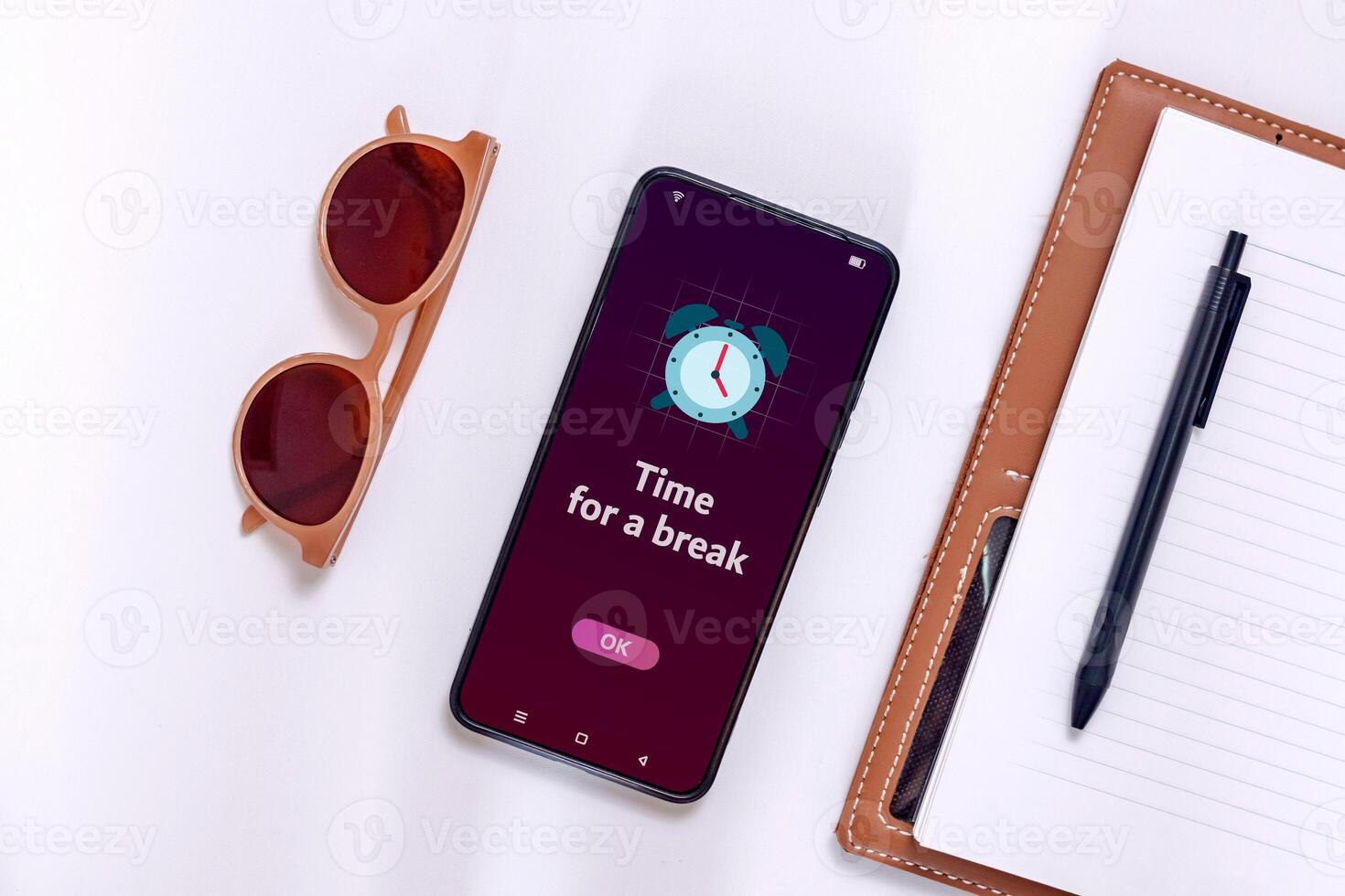 A smartphone with time for a break notification. Take a break from your phone or activity concept. photo