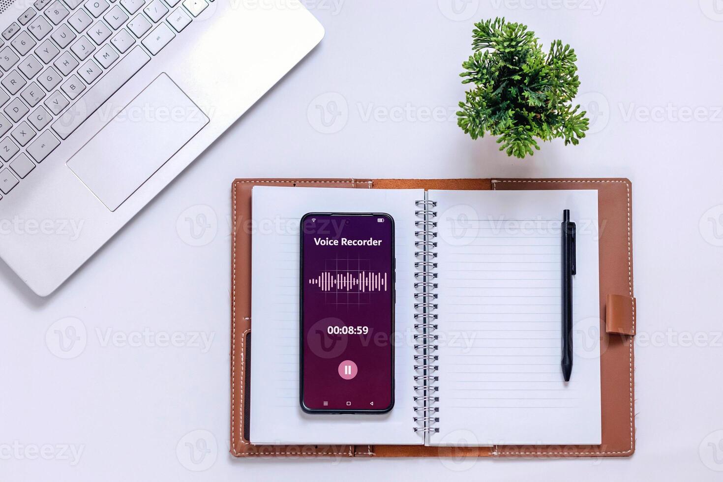 A smartphone recording sound during a meeting to take minutes. Audio recording for meeting notes concept. photo