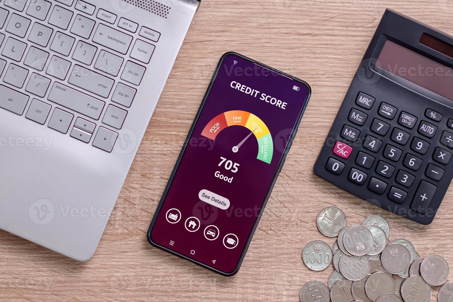 A smartphone on a desk with credit score on the phone screen. Online credit score ranking check to apply for loan. photo
