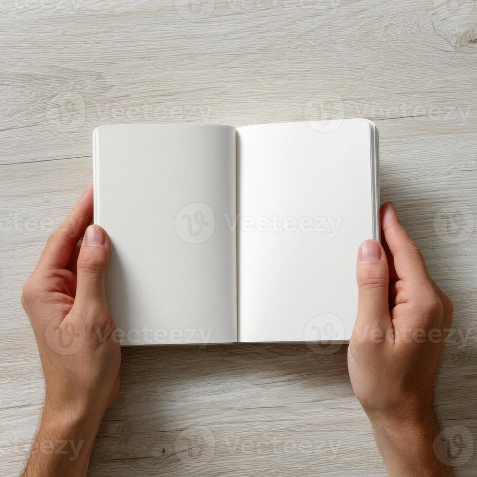 Hands holding a blank journal photo