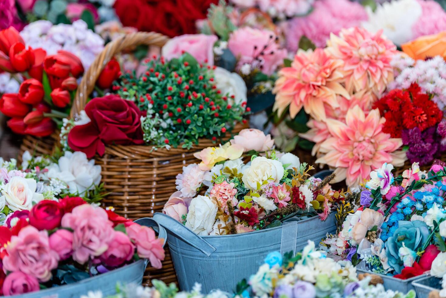 Bouquet artificial flowers in flower vase and baskets for interior design and decoration artificial flower fabric rose bouquet background. photo