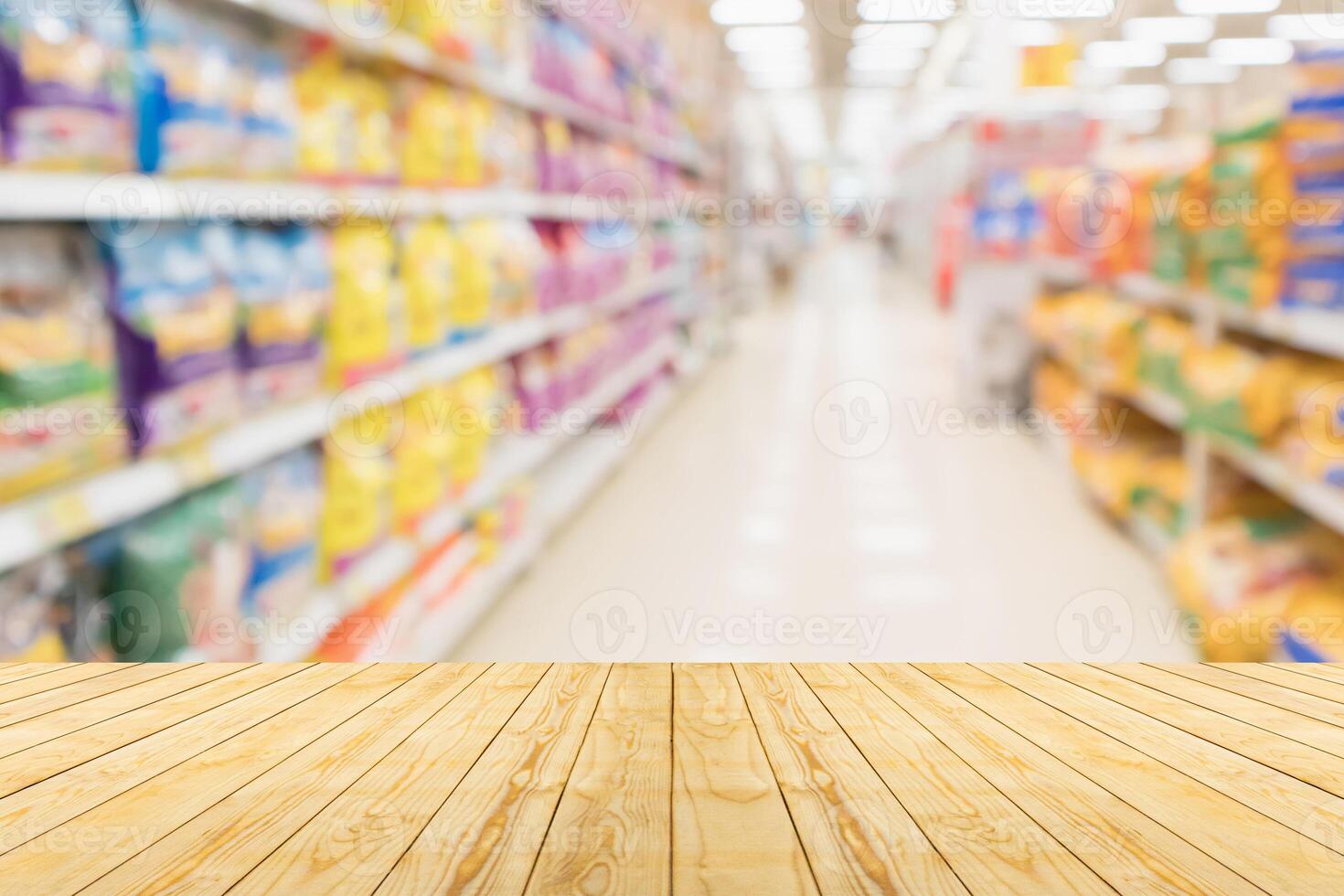 Wooden floor in a supermarket with shelves of food photo