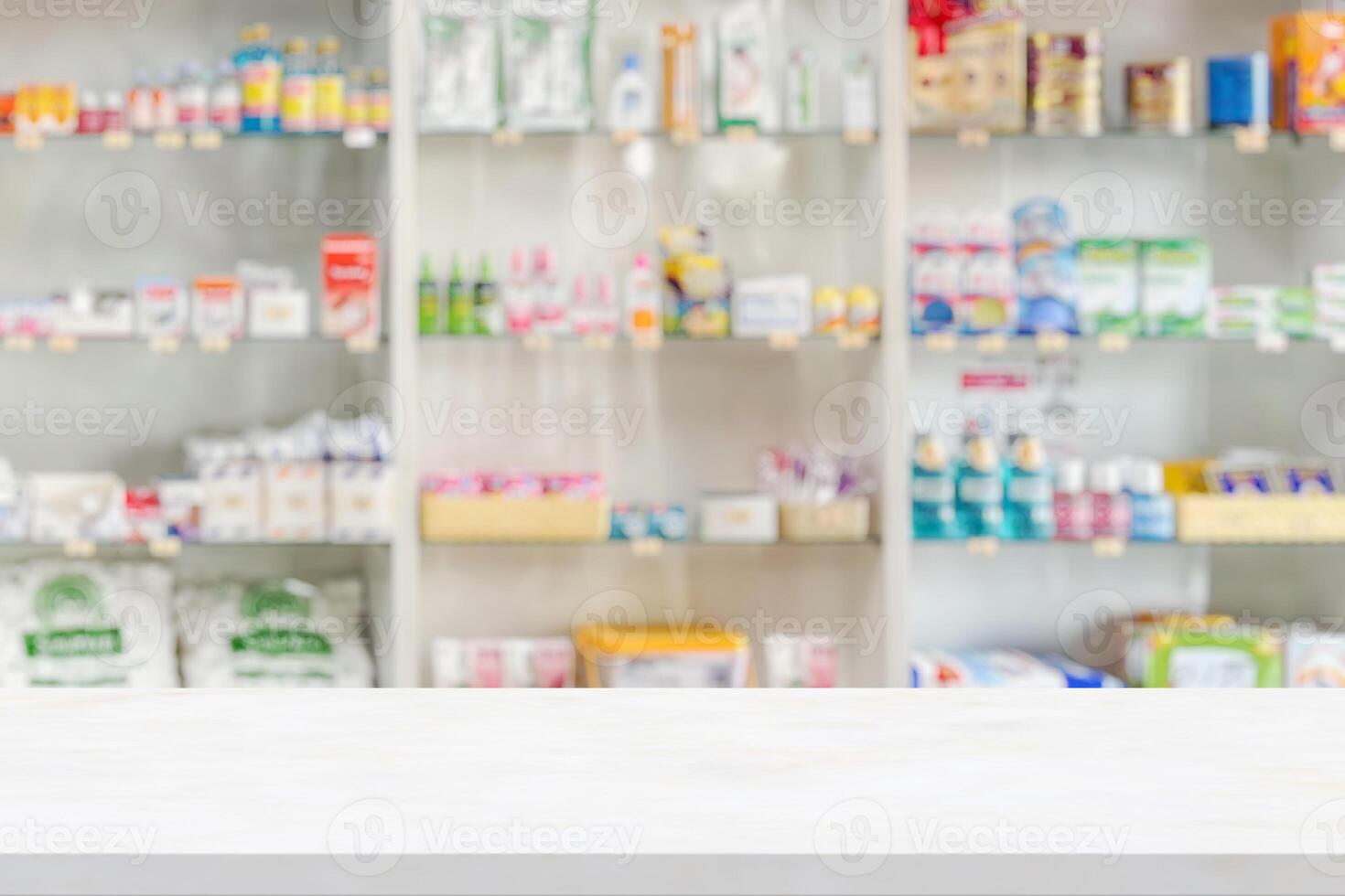 Table top in pharmacy store with shelves of medicines and other products photo