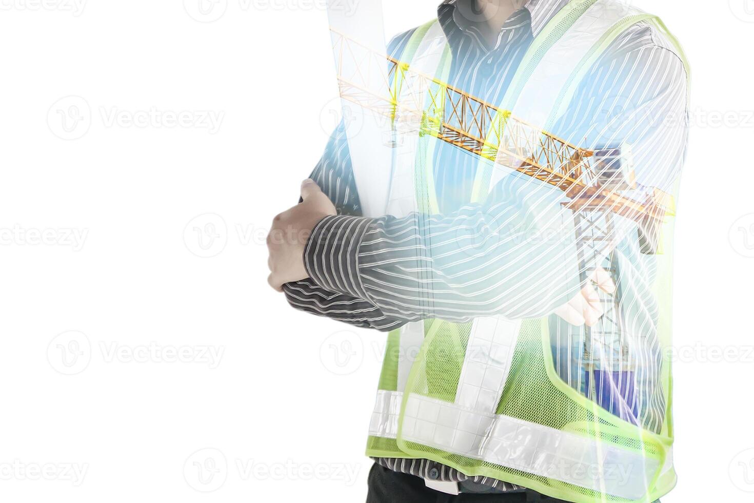 A man in a safety vest standing with his arms crossed photo