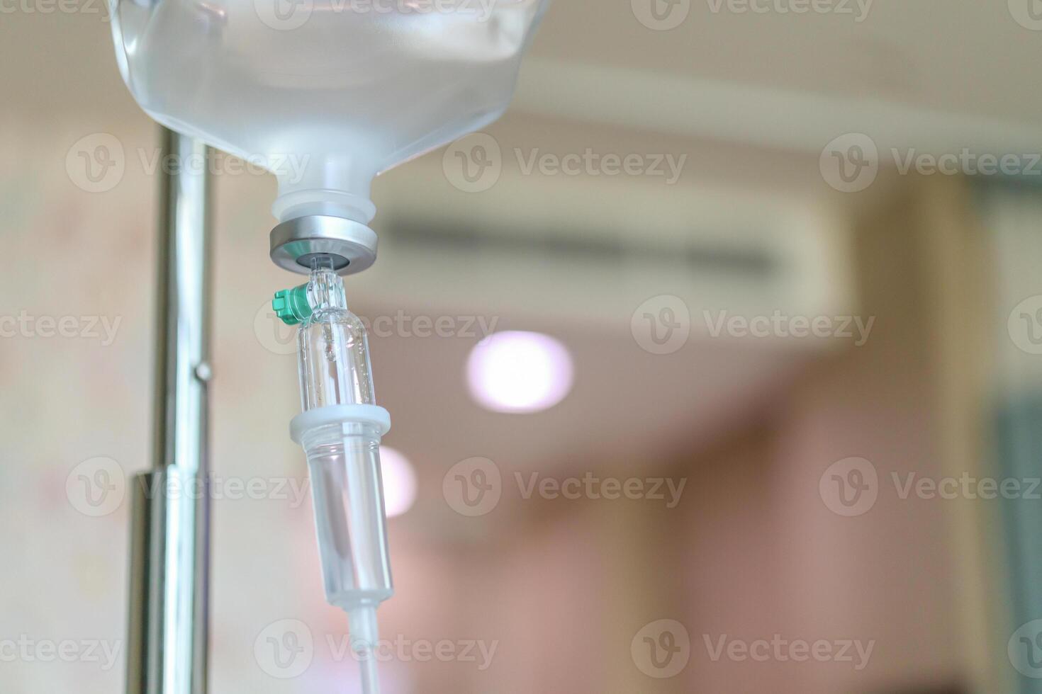A drip is attached to a metal stand photo